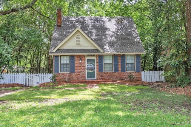 844 E Edgemont Ave, Montgomery, AL 36111 - view of front of house with a chimney, brick siding, and roof with shingles