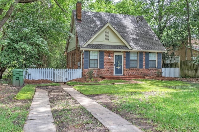 844 E Edgemont Ave, Montgomery, AL 36111 - view of front of property with brick siding, a chimney, and roof with shingles