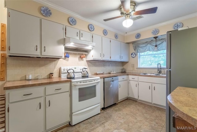 3748 Jasmine Hill Rd, Wetumpka, AL 36093 - kitchen with stainless steel appliances, under cabinet range hood, ornamental molding, ceiling fan, and tasteful backsplash