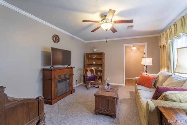 3748 Jasmine Hill Rd, Wetumpka, AL 36093 - living area with a ceiling fan, crown molding, a glass covered fireplace, and light colored carpet