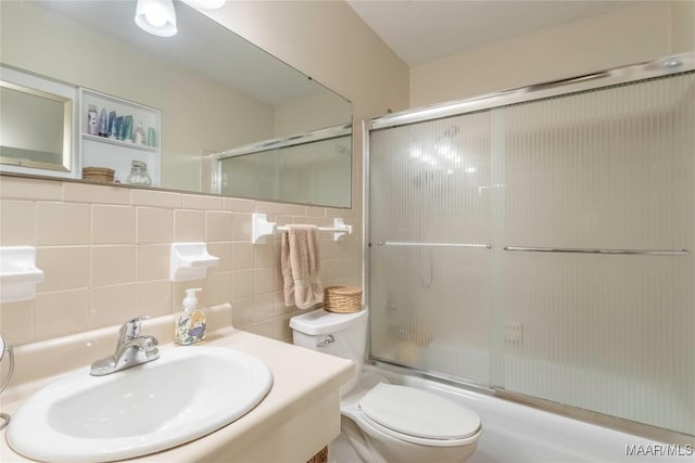 3748 Jasmine Hill Rd, Wetumpka, AL 36093 - bathroom featuring shower / bath combination with glass door, tile walls, and vanity