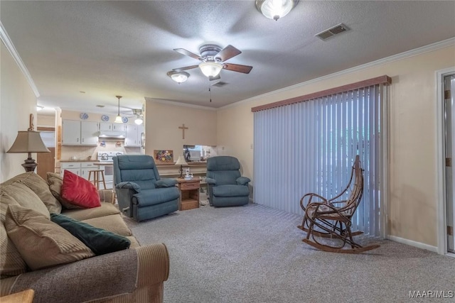 3748 Jasmine Hill Rd, Wetumpka, AL 36093 - carpeted living area with crown molding, ceiling fan, and a textured ceiling