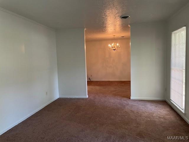 2300 Wentworth Dr, Montgomery, AL 36106 - unfurnished room with a chandelier, carpet floors, and healthy amount of natural light