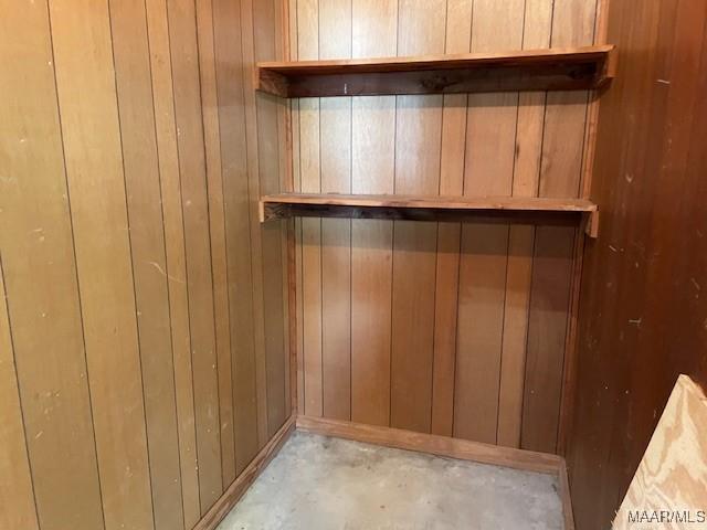 2300 Wentworth Dr, Montgomery, AL 36106 - detailed view of unfinished concrete flooring and wooden walls