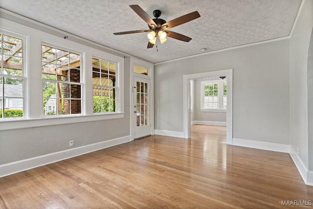102 Vonora Ave, Montgomery, AL 36107 - spare room featuring a textured ceiling, wood finished floors, a ceiling fan, and ornamental molding