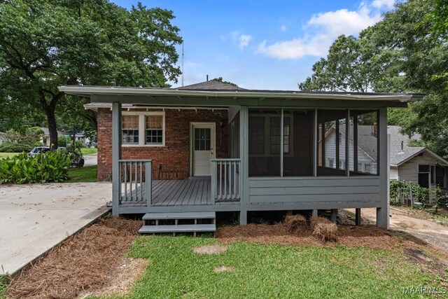 102 Vonora Ave, Montgomery, AL 36107 - rear view of property with brick siding and a sunroom