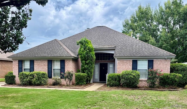 7117 Stamford Ct, Montgomery, AL 36117 - view of front of home featuring brick siding, a shingled roof, and a front lawn