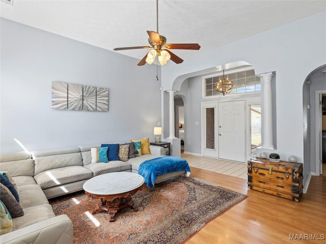 7117 Stamford Ct, Montgomery, AL 36117 - living room featuring arched walkways, ornate columns, wood finished floors, and ceiling fan