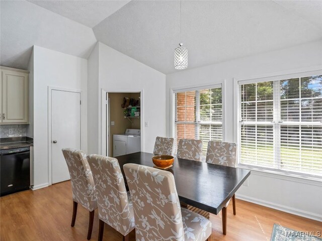 7117 Stamford Ct, Montgomery, AL 36117 - dining space featuring independent washer and dryer, light wood finished floors, and vaulted ceiling