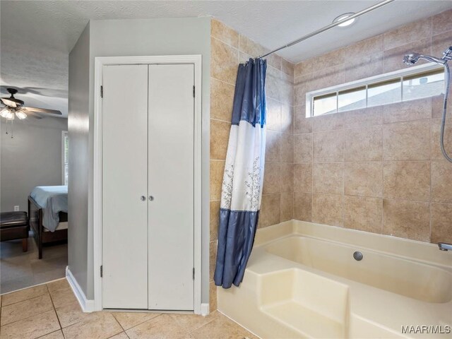7117 Stamford Ct, Montgomery, AL 36117 - full bath with shower / bath combo with shower curtain, tile patterned flooring, a ceiling fan, and connected bathroom