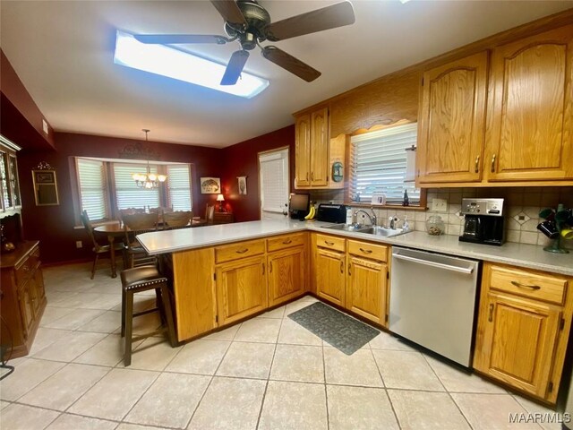 5240 Airport Rd, Millbrook, AL 36054 - kitchen with dishwasher, a peninsula, a chandelier, and light countertops