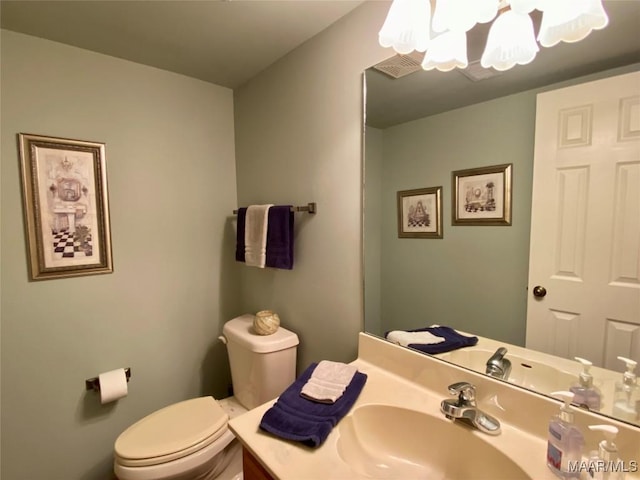 5240 Airport Rd, Millbrook, AL 36054 - half bathroom featuring a chandelier and vanity