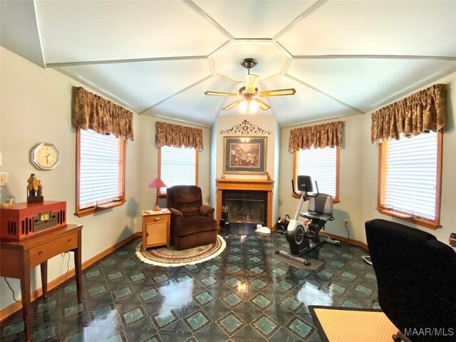 5240 Airport Rd, Millbrook, AL 36054 - living area featuring a fireplace, a ceiling fan, plenty of natural light, and vaulted ceiling