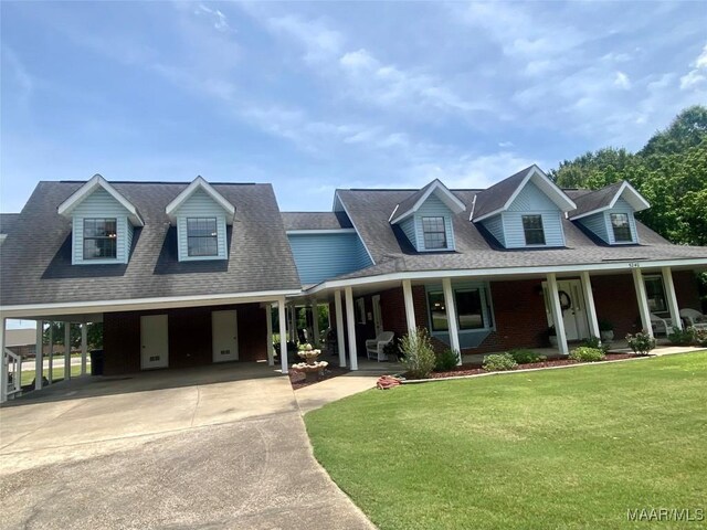 5240 Airport Rd, Millbrook, AL 36054 - view of front of home with driveway, a front lawn, covered porch, roof with shingles, and an attached carport