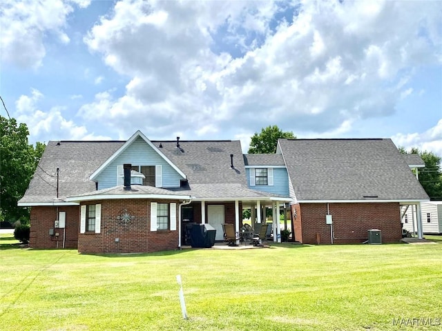 5240 Airport Rd, Millbrook, AL 36054 - back of property with brick siding, a lawn, and roof with shingles