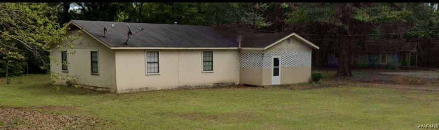 3360 Glenn Dr Unit 1, Millbrook, AL 36054 - view of side of home with a yard and stucco siding