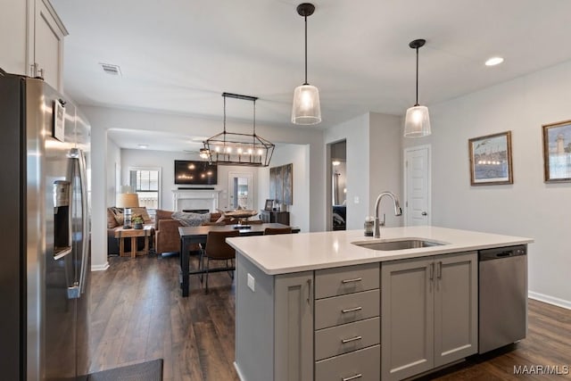 904 Hedgefield Way, Prattville, AL 36066 - kitchen with stainless steel appliances, gray cabinets, light countertops, dark wood-type flooring, and a center island with sink