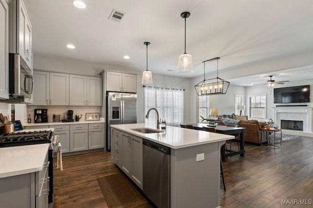 904 Hedgefield Way, Prattville, AL 36066 - kitchen with appliances with stainless steel finishes, gray cabinets, ceiling fan, light countertops, and recessed lighting