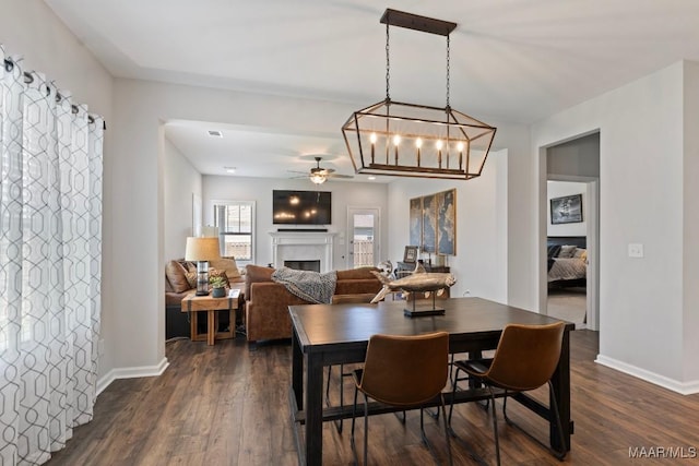 904 Hedgefield Way, Prattville, AL 36066 - dining area featuring ceiling fan, a fireplace, dark wood finished floors, and a chandelier
