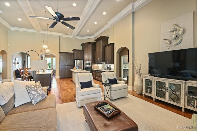 8612 Birchwood Ct, Montgomery, AL 36116 - living area featuring arched walkways, a high ceiling, light wood finished floors, a ceiling fan, and recessed lighting