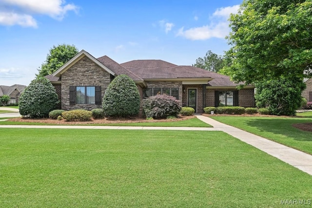 8612 Birchwood Ct, Montgomery, AL 36116 - view of front of house with a front lawn, brick siding, stone siding, and roof with shingles