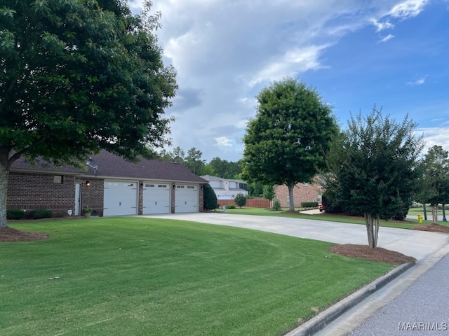 8612 Birchwood Ct, Montgomery, AL 36116 - view of front of house featuring a garage, a front yard, driveway, and brick siding