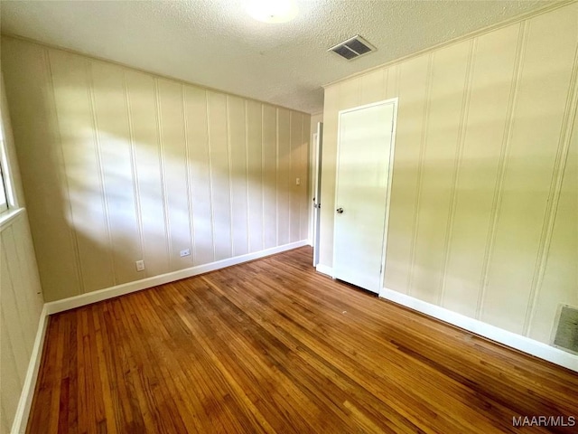 2441 Spruce Curv, Montgomery, AL 36107 - empty room featuring hardwood / wood-style floors and a textured ceiling