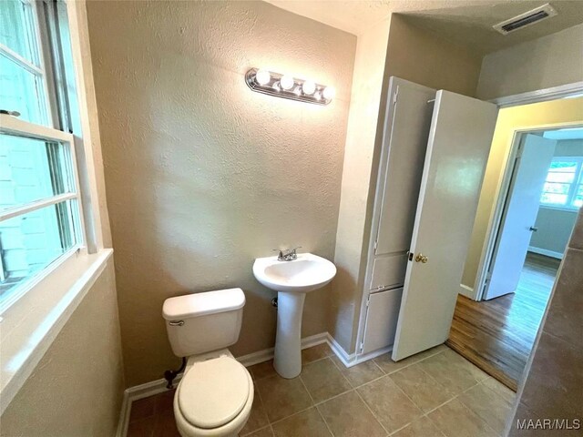 2441 Spruce Curv, Montgomery, AL 36107 - bathroom with tile patterned flooring and a textured wall