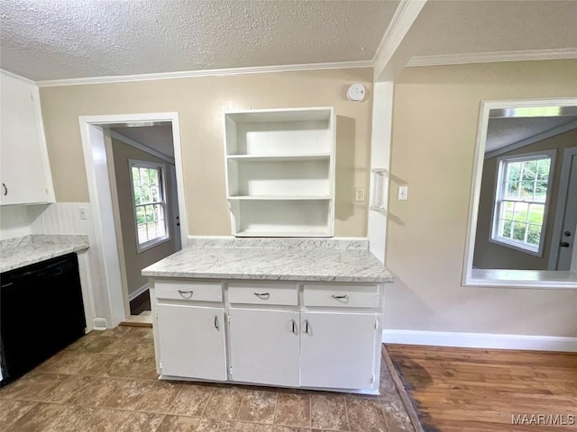 2441 Spruce Curv, Montgomery, AL 36107 - kitchen featuring black dishwasher, plenty of natural light, a textured ceiling, white cabinetry, and ornamental molding