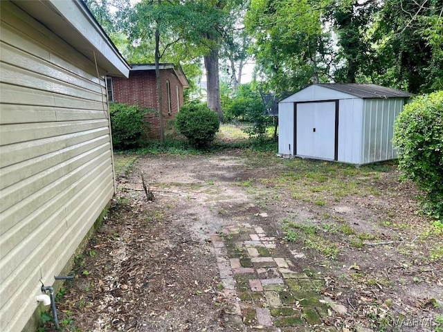 2441 Spruce Curv, Montgomery, AL 36107 - view of yard featuring a storage unit