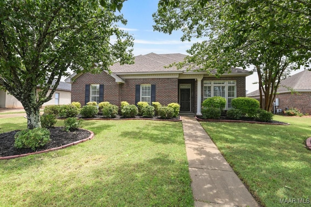 1031 Fawnview Rd, Montgomery, AL 36117 - view of front of property featuring brick siding, a front lawn, and roof with shingles
