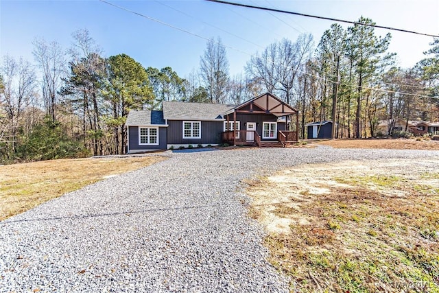 11056 Central Plank Rd, Eclectic, AL 36024 - view of front facade with a storage unit, driveway, and roof with shingles