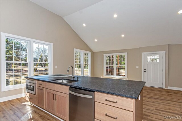 11056 Central Plank Rd, Eclectic, AL 36024 - kitchen with stainless steel appliances, wood finished floors, recessed lighting, light brown cabinetry, and a kitchen island with sink
