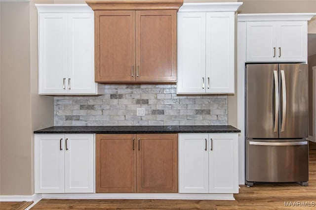 11056 Central Plank Rd, Eclectic, AL 36024 - kitchen with freestanding refrigerator, decorative backsplash, and wood finished floors