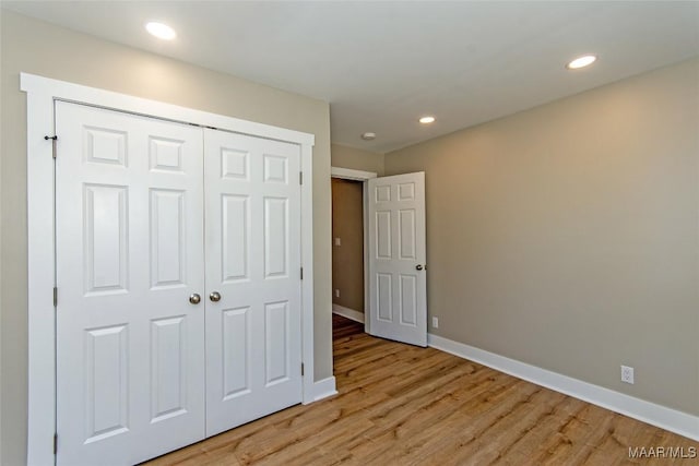 11056 Central Plank Rd, Eclectic, AL 36024 - unfurnished bedroom featuring light wood-style floors, recessed lighting, and a closet