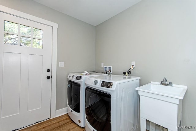 11056 Central Plank Rd, Eclectic, AL 36024 - laundry area with separate washer and dryer and light wood finished floors