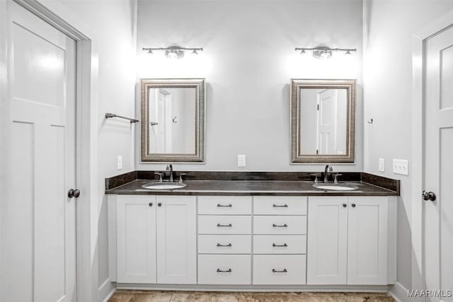 7918 Long Acre St, Montgomery, AL 36116 - full bathroom featuring double vanity and baseboards