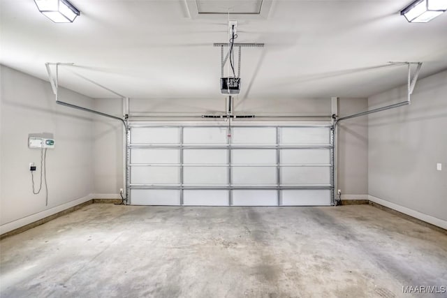 7918 Long Acre St, Montgomery, AL 36116 - garage featuring a garage door opener and baseboards