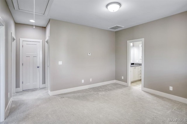 7918 Long Acre St, Montgomery, AL 36116 - spare room featuring attic access and light carpet
