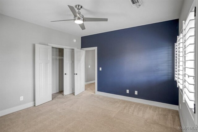 7918 Long Acre St, Montgomery, AL 36116 - unfurnished bedroom featuring carpet floors, a closet, and a ceiling fan