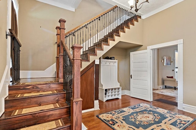 1802 Madison Ave, Montgomery, AL 36107 - stairs featuring crown molding, wood finished floors, and a high ceiling