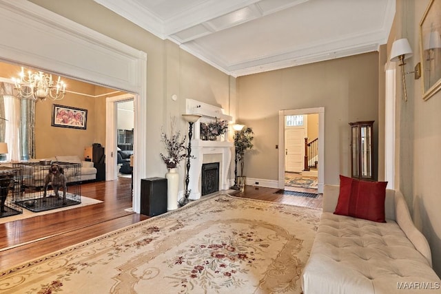 1802 Madison Ave, Montgomery, AL 36107 - living room with wood finished floors, a fireplace, crown molding, stairway, and a chandelier