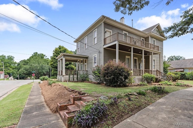 1802 Madison Ave, Montgomery, AL 36107 - view of front of home with a porch, a balcony, and a chimney