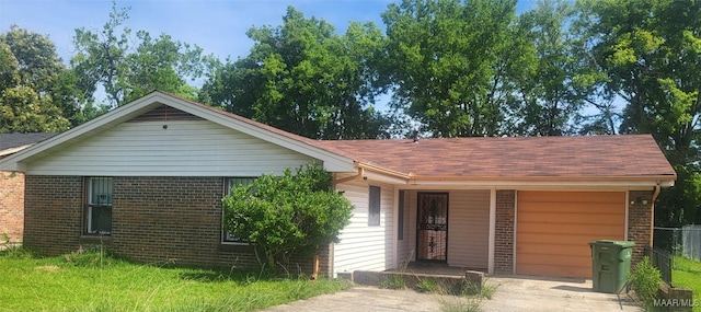 421 Jeffrey Dr, Montgomery, AL 36108 - ranch-style house with concrete driveway, brick siding, and an attached garage