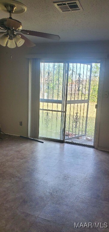421 Jeffrey Dr, Montgomery, AL 36108 - spare room featuring a ceiling fan and a textured ceiling