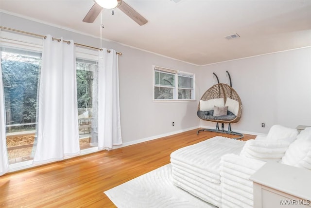 3534 Milan Dr, Montgomery, AL 36109 - sitting room featuring wood finished floors, a ceiling fan, and crown molding