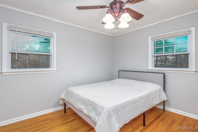 3534 Milan Dr, Montgomery, AL 36109 - bedroom featuring wood finished floors, crown molding, and a ceiling fan