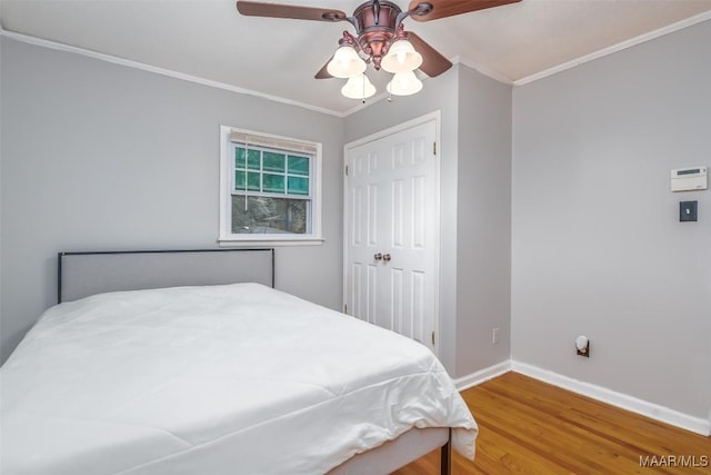 3534 Milan Dr, Montgomery, AL 36109 - bedroom with ornamental molding, wood finished floors, a closet, and ceiling fan