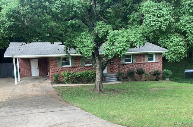 3534 Milan Dr, Montgomery, AL 36109 - view of front facade with concrete driveway, a front lawn, brick siding, and a shingled roof