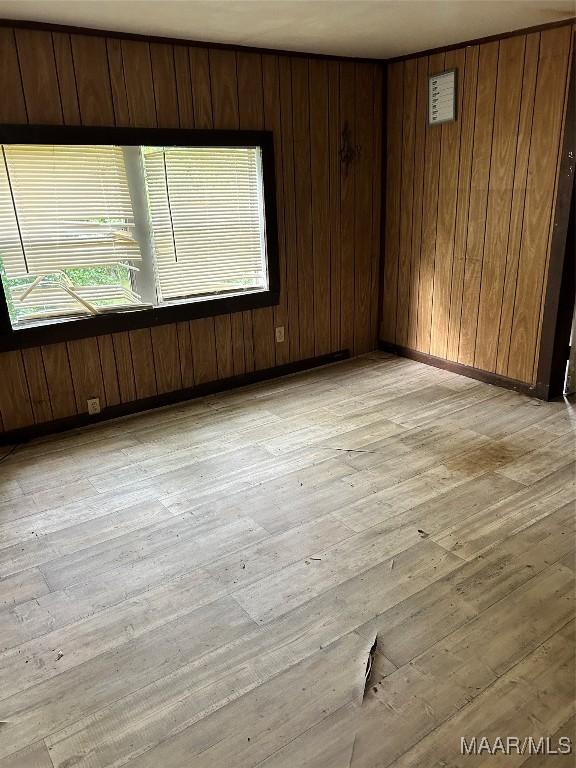 345 Byrd St, Auburn, AL 36832 - spare room with light wood finished floors and wooden walls